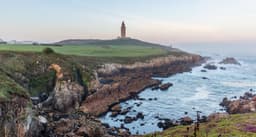 Tower of Hercules above A Coruña's Atlantic coastline at sunrise